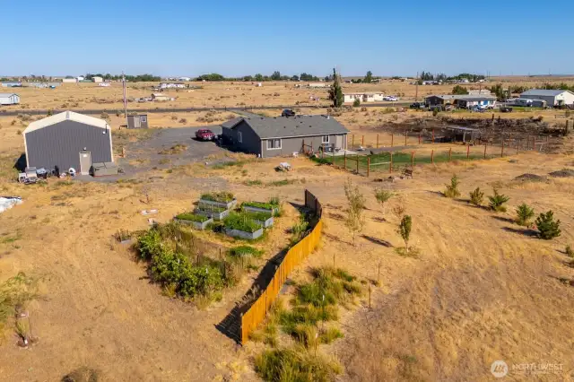 Garden area, shop, home and fenced backyard