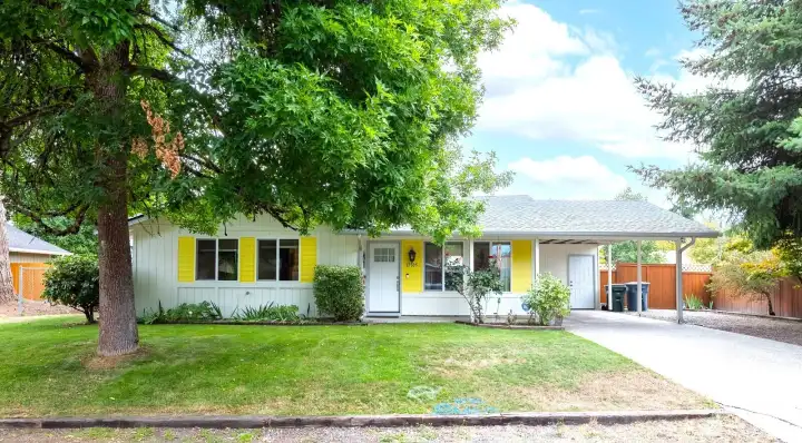 This is a three-bedroom, one-bath home with 1,016 square feet on a 7,500 square foot lot, featuring a remodeled kitchen, spacious backyard, and covered carport.