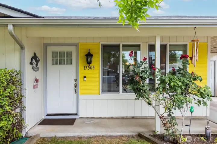 Covered entryway with a low threshold door makes the home easily accessible.