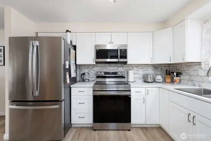Brand new cabinets, fresh paint and tile backsplash.