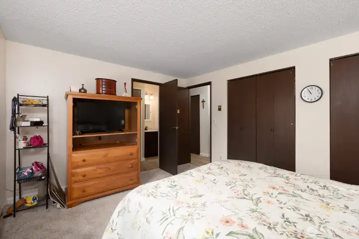 Comfort meets charm in the primary bedroom.