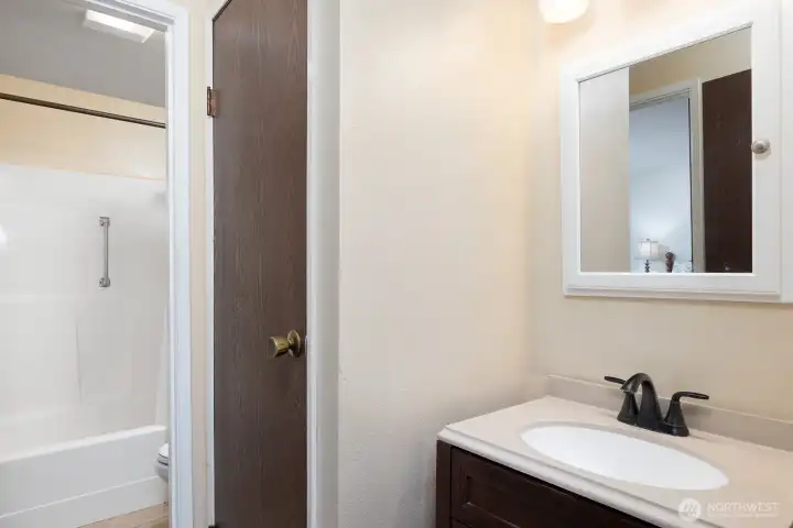 Well-appointed bath with clean, updated finishes.