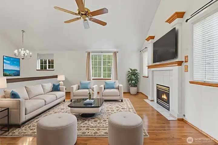 Enjoy a spacious family room with vaulted ceilings a cozy fireplace, and lots of light throughout! Note: Virtually staged.