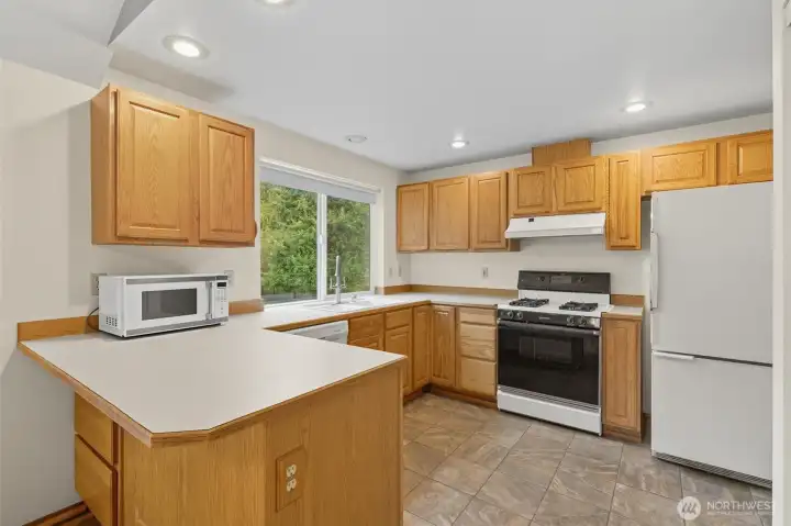 Everything you need in a kitchen.  Functional, plenty of storage and easily accessible pantry!