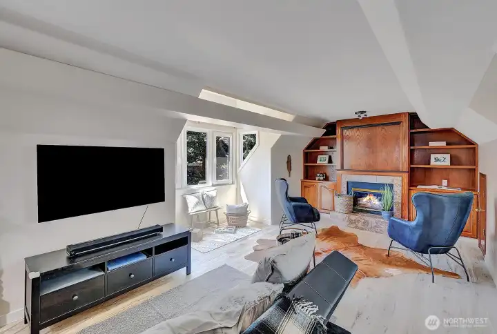 Spacious room above garage serves as a play or office room