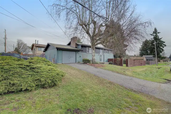 Sitting on a wonderful and large corner lot in a convenient location, walking distance to shops and restaurants in old town burien