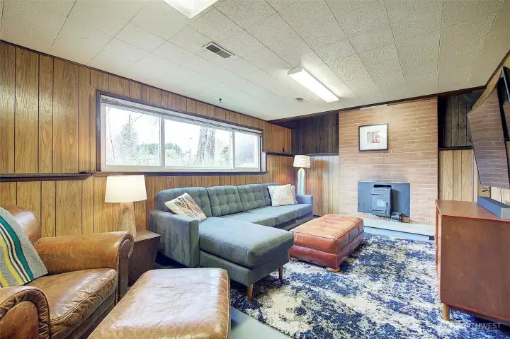 Lower level has nice family room with its own fireplace/wood stove. Very nice, cozy setting