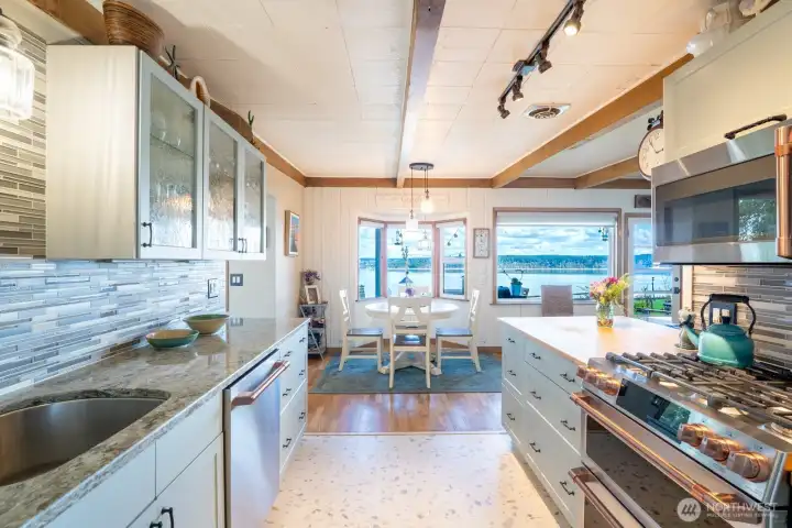 Natural light fills this updated, functional kitchen, complemented by a beautiful view
