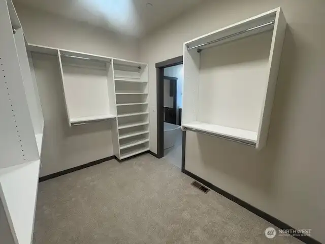 Walk in closet with custom systems