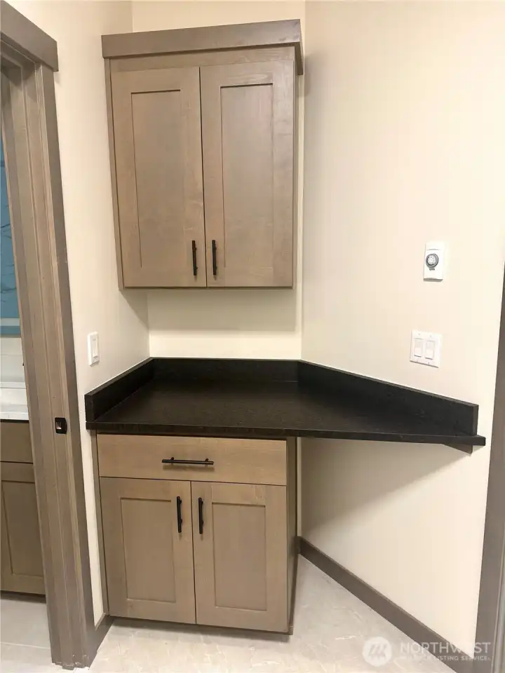 Laundry room on upper floor can be accessed from hallway, or directly from the primary suite bathroom.