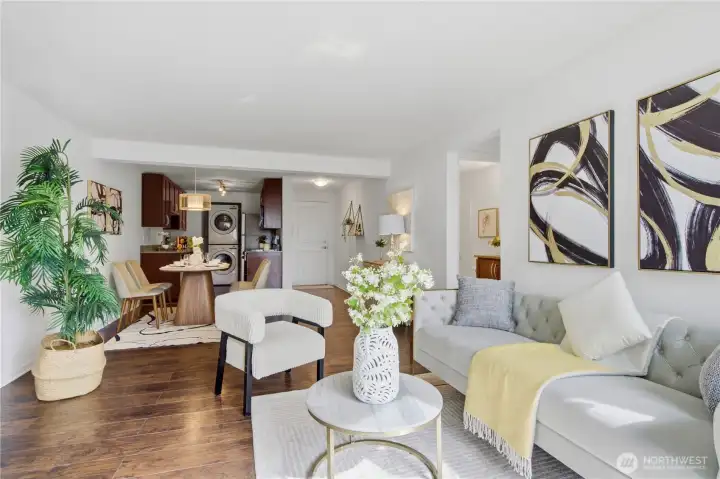 Open floor plan with kitchen, dining, and living areas