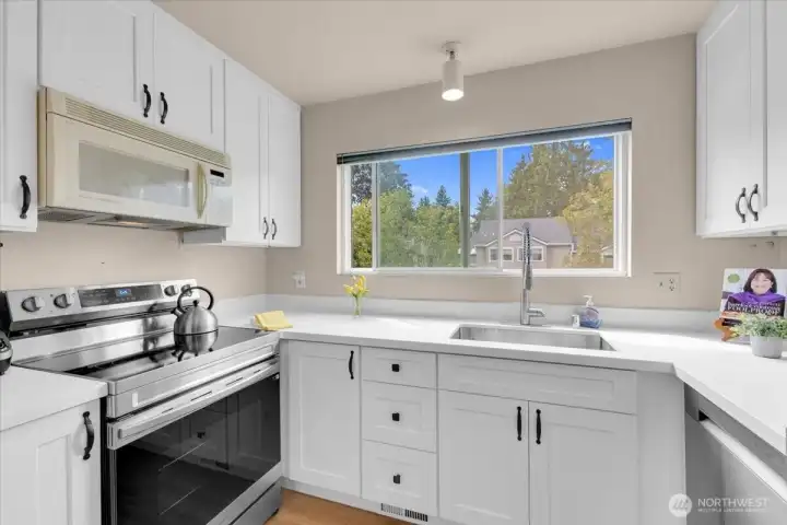 Updated kitchen with microwave being replaced at closing