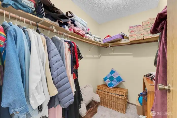 Primary bedroom walk in closet
