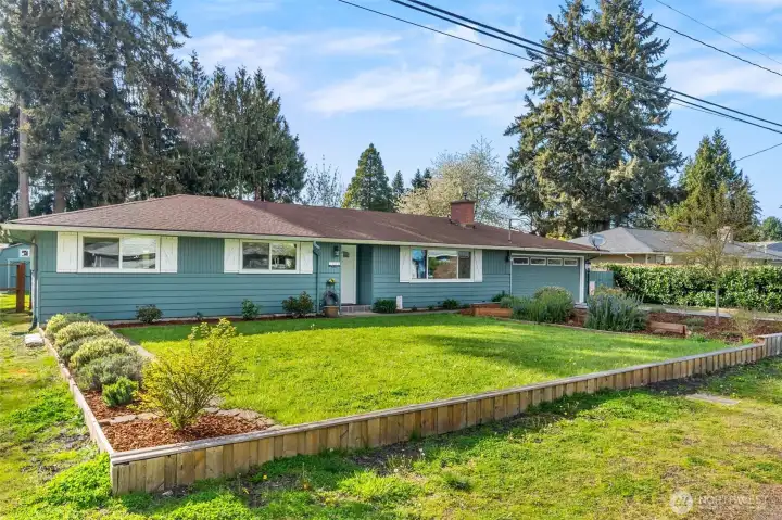 Classic single-level design set on a generous flat lot.