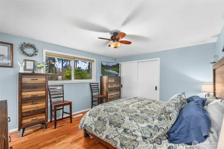 The primary bedroom offers a comfortable retreat designed for rest and relaxation.