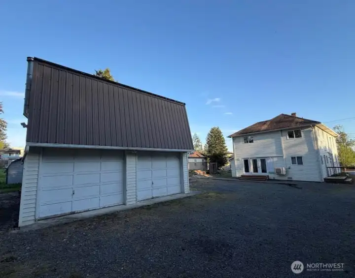 Detached 2-car garage/shop with loft + separate entrance—ideal for ADU/DADU, office, or additional rental unit.