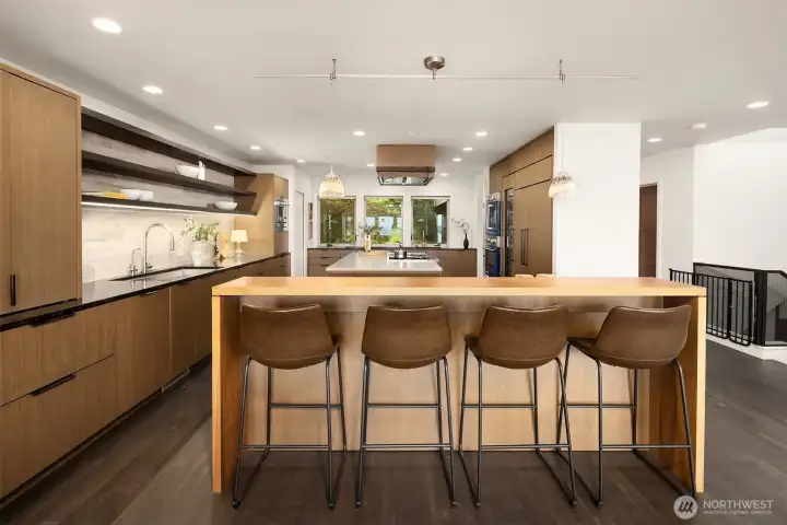 Sub-Zero refrigerator drawers at the far left of this photo.  Over-counter lights.