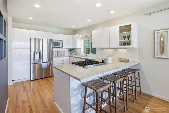 Truly a cook's kitchen with a Viking range and downdraft vent, LG fridge with 4 kinds of ice and a Fisher & Paykel 2 drawer dishwasher.