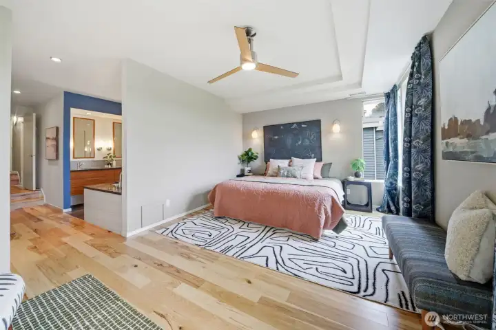 The primary bedroom has a king sized bed and still has plenty of room.