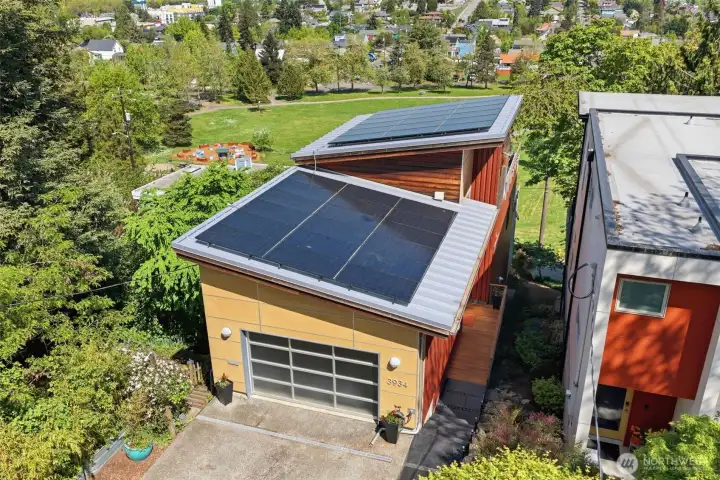 Lots of solar panels ands an EV charger in the driveway.