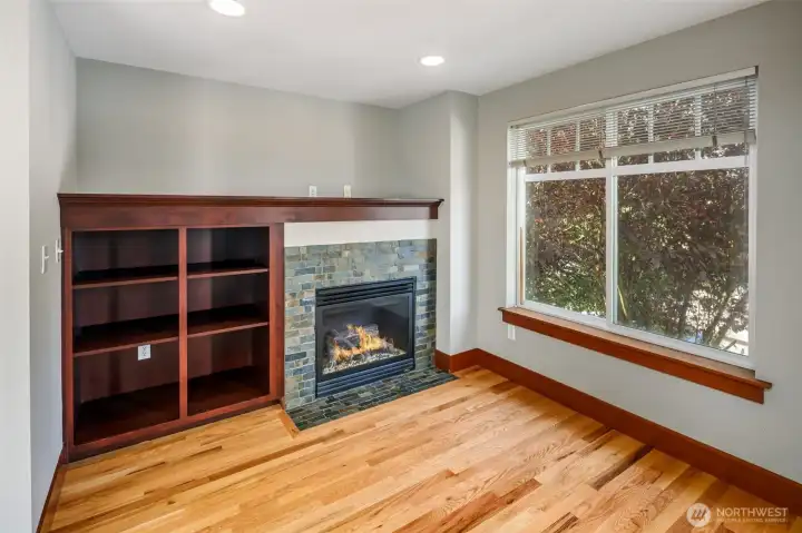 Dining and living room areas with gas fireplace
