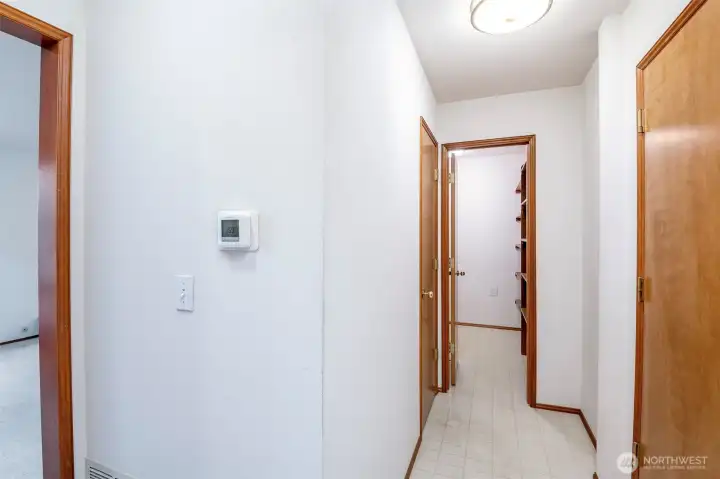 Hallway to garage, 1/2 bathroom & HUGE walk-in storage room