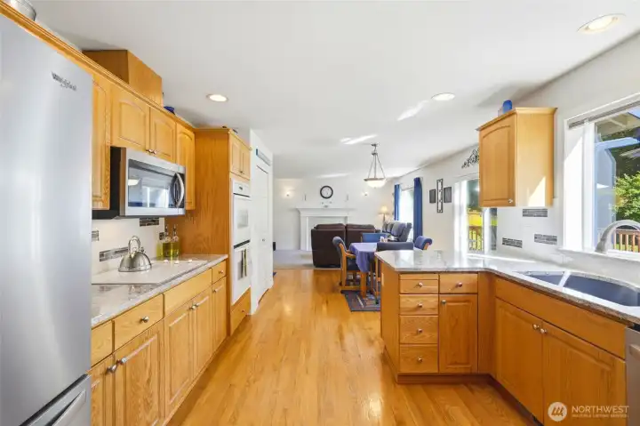 The Kitchen has granite countertops, updated sink/faucet and is open to the Family Room and Eating Nook. The Kitchen has granite countertops, updated sink/faucet and is open to the Family Room and Eating Nook.