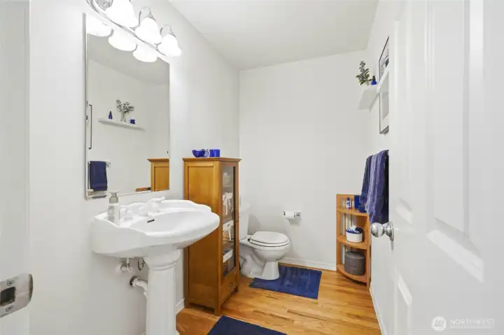 The Powder Room on the main floor is located close to guests. The Powder Room on the main floor is located close to guests.