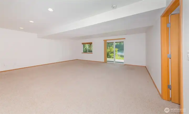 Rec. Room showing exit to back yard & lake