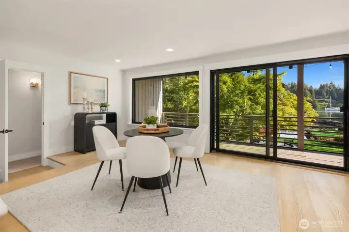 2nd dining room OR den/family room off the kitchen. Amazing! And more deck access...