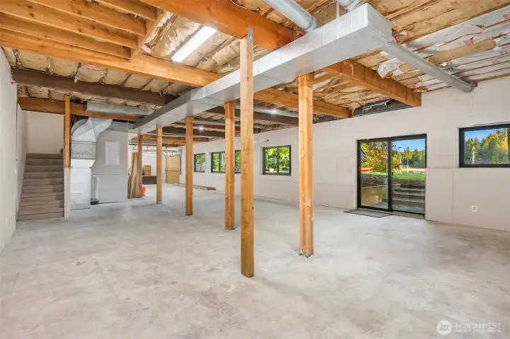 But wait... there's more! Much more. A 1944 sq ft partially finished basement with walkout access and a garage roll up door!