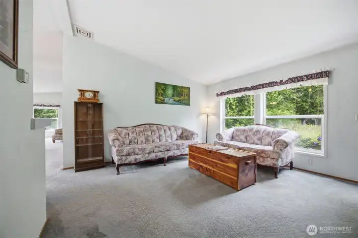 The living room is very spacious and open tot he dining room and kitchen.