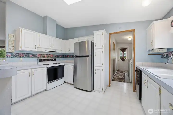 The kitchen has an abundance of storage and counter space.