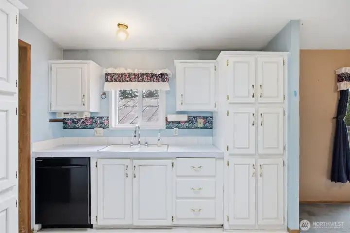 The kitchen looks out to the front of the home and the driveway.