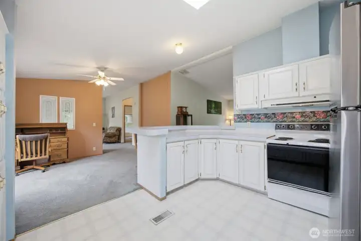 Looking across the kitchen and dining room with the 2nd and 3rd bed off the family room.