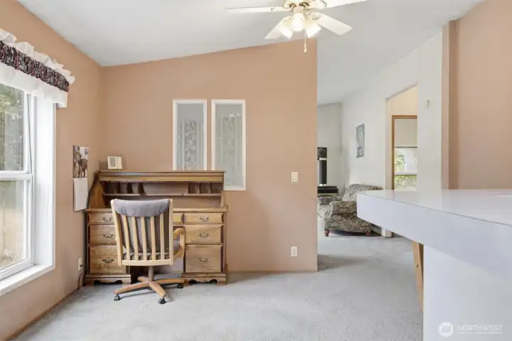 The family room is beyond the dining room.