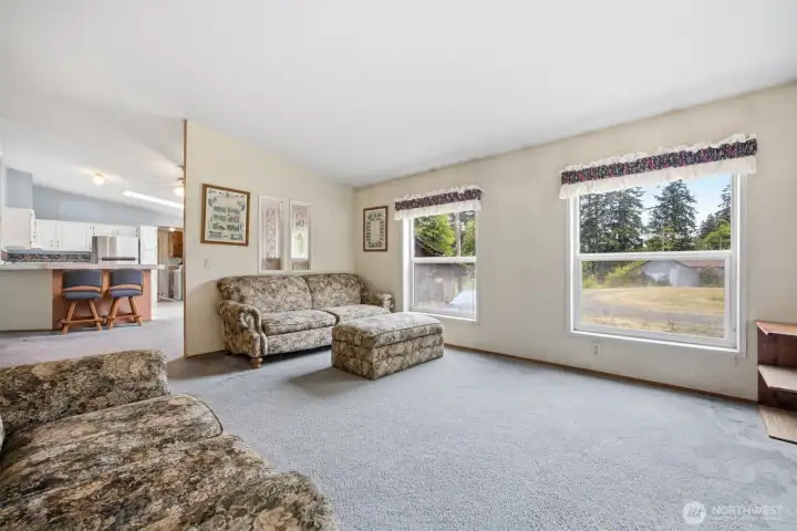 Looking toward  the dining room and kitchen beyond from the family room.