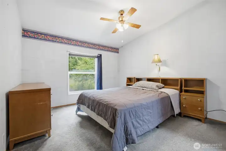 The primary bedroom ensuite is just off the living room and looks to the rear yard.