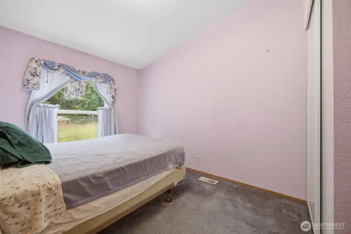 The second bedroom is just off the family room and looks to the rear yard.