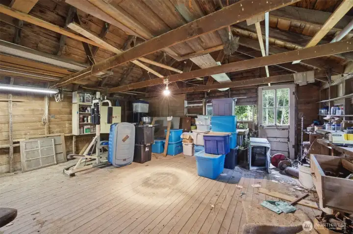 This shop is very spacious and has a wood floor.