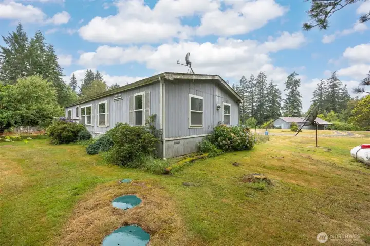 Looking over the septic toward the corner of the home.