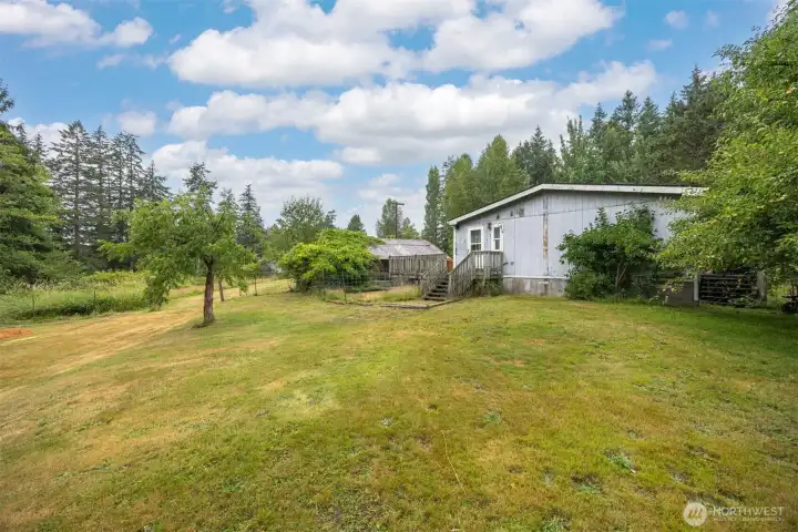 Looking from the workshop building toward the home.