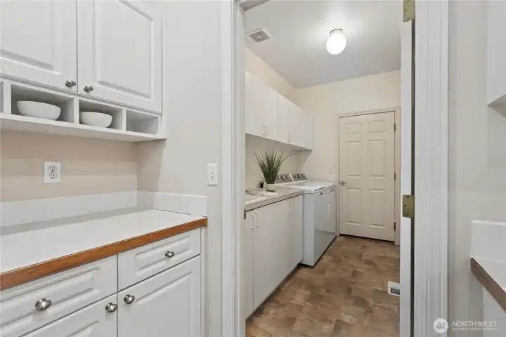 A mud room with sink, off the garage -washer and dryer included.