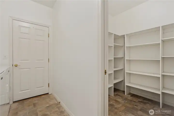 Check out this amazing walk in kitchen pantry. Tons of storage in this unit.
