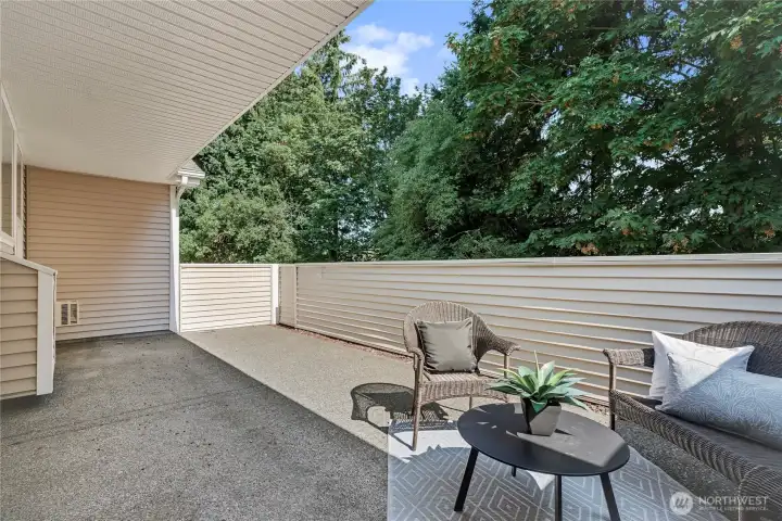 New half-wall for patio privacy with a gate to back yard, maintained by the HOA.