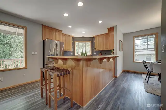 The kitchen has beautiful oak cabinetry and stainless steel appliances.
