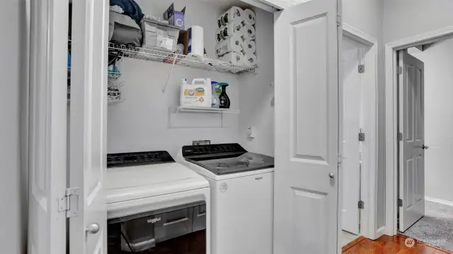 Washer & Dryer plus storage space is conveniently located in the hall near both bedrooms.