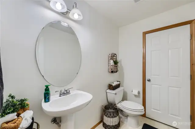 main level spacious 1/2 bath with large linen closet to keep you organized!