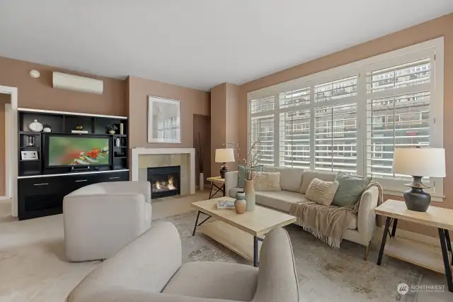 Relax in this spacious living room, outfitted with an oversized gas fireplace, built-in Bose sound system and custom wood shutters.