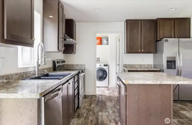 Kitchen looking into laundry